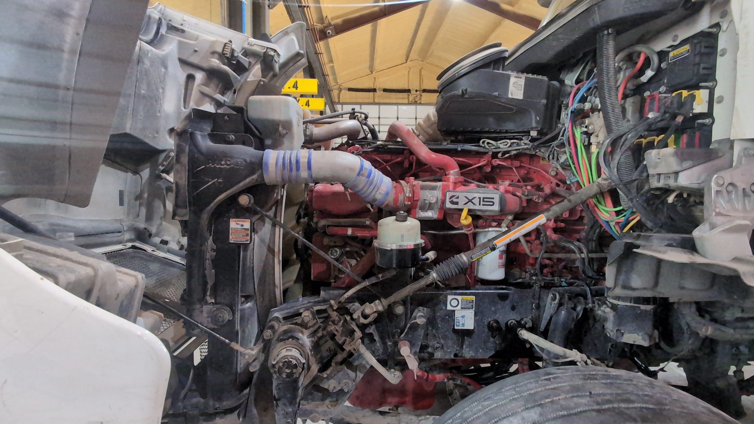 Cummins X15 engine exposed in a Burnside service bay