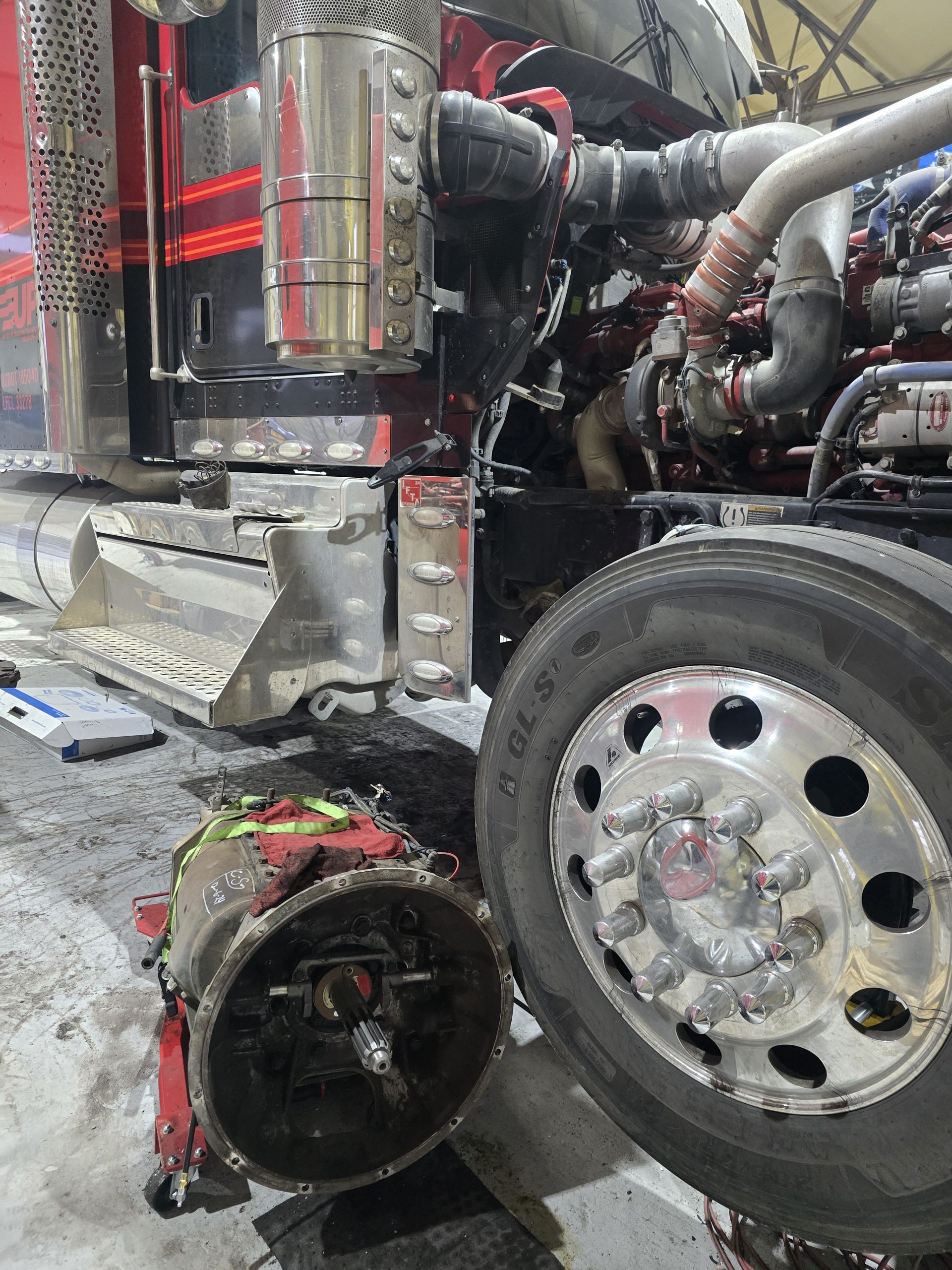 Front wheel-end and axle components exposed during truck service at Burnside
